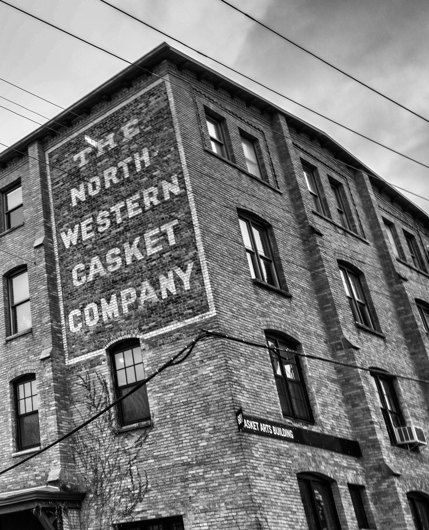 The Northwestern Casket Company ghost sign on the Casket Arts building